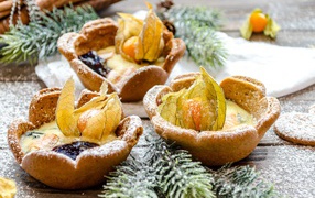 Shortbread cookies with physalis and spruce branches on the table