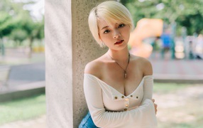 Asian girl with short hair against the wall