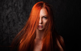 Bright red-haired girl with blue eyes