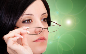 Business girl with brown eyes wearing glasses