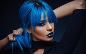 Girl with blue hair on a black background
