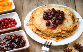 Pancakes with cherry jam for Maslenitsa