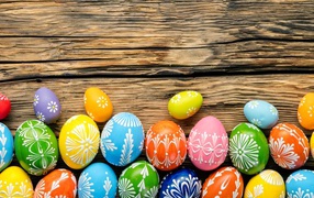 Multicolored bright eggs with ornament for Easter