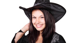 Smiling girl dressed as a witch for Halloween