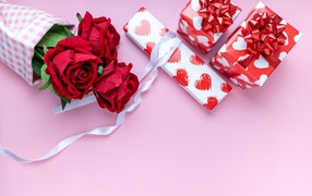 Roses and gifts on a pink background for International Women's Day on March 8