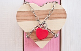 Wooden heart closed on a chain