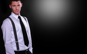 Handsome guy in white shirt on black background