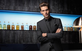 Handsome man in suit at the bar