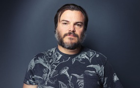 Actor Jack Black on a gray background