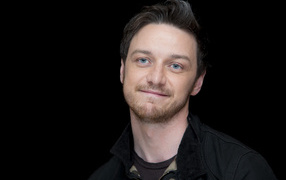 Blue-eyed actor James McAvoy on a black background