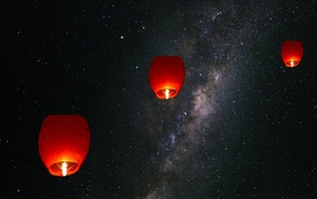 Lit Chinese lanterns in the sky