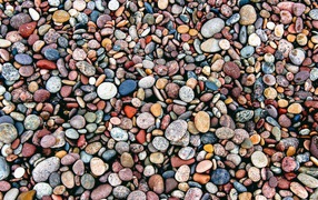 Small multi-colored stones on the seashore