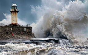 Storm waves hitting the lighthouse