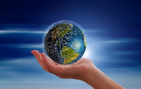 The planet earth in the grid lies in the palm of your hand