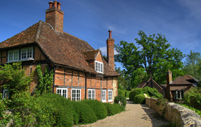 Brick old house under blue sky, England