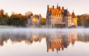 Azay-le-Rideau castle by the pond at sunrise, France