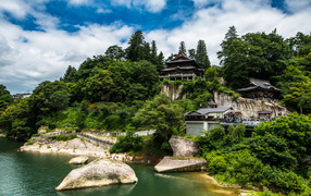 Temple on the bank of a mountain by the river, Japan