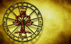 Libra zodiac sign on yellow background