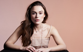 Actress Keira Knightley on a pink background