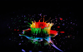 Splashes of multi-colored paint on a black background 3D graphics