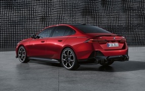 Rear view of the red 2023 BMW I5 M60 XDrive M Performance Parts car