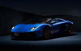 Blue Lamborghini Aventador car on a black background
