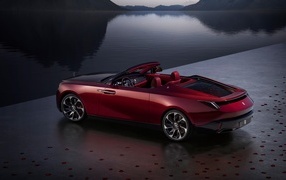 2023 Rolls-Royce La Rose Noire Droptail convertible sits by the water