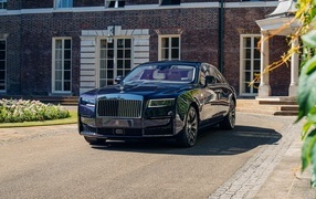 Black car Rolls-Royce Ghost at the house
