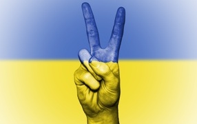 Hand with the flag of Ukraine