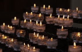 Many lit small candles