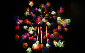 Multicolored firework sparks on a black background