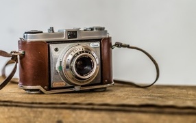 Old vintage camera on the table