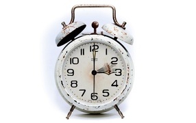 White iron alarm clock with rust