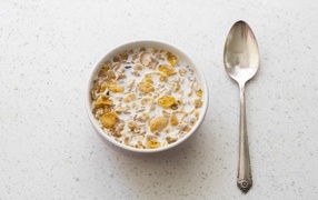 Cereal with milk in a plate for breakfast