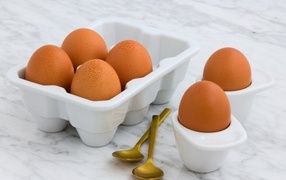 Eggs on the table with spoons