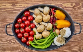 Fresh appetizing vegetables in a large frying pan