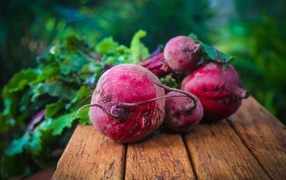 Fresh red beets on a wooden table
