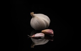 Head of garlic on a black background