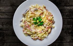 Pasta carbonara on a large white plate