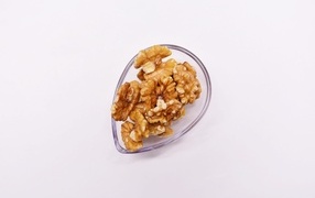 Peeled walnuts on a white background
