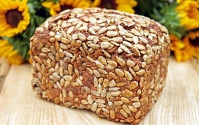 Loaf of bread with seeds on the table