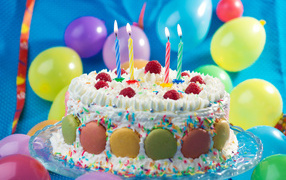 Appetizing birthday cake with candles