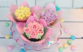 Cupcakes decorated with cream flowers