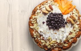 Delicious sweet cake with nuts and blueberries
