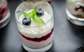 Glass with dessert and blueberries