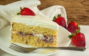 Large piece of cake with strawberries