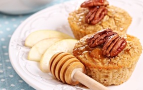 Muffins with honey, nuts and apple pieces