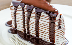 Piece of pancake cake with chocolate