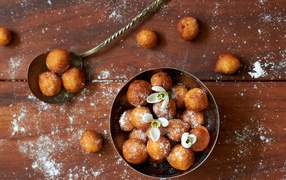Sweet cheese balls with powdered sugar