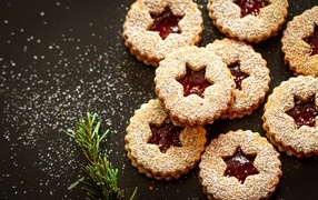 Sweet cookies with jam and powdered sugar